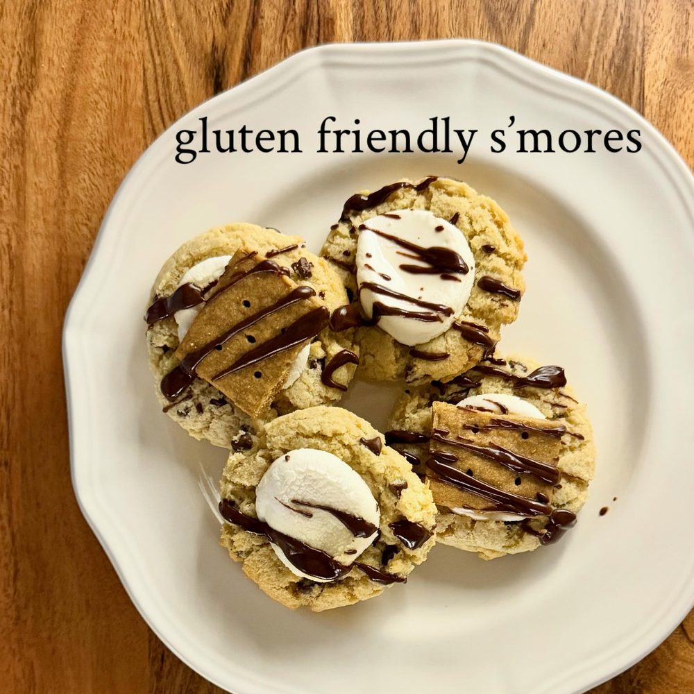 Gluten-friendly S'mores cookies topped with marshmallow and chocolate drizzle